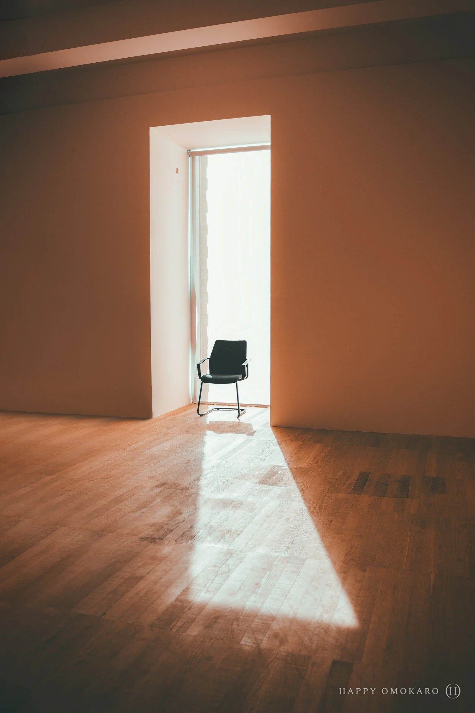 A lone chair standing in the middle of an otherwise empty room